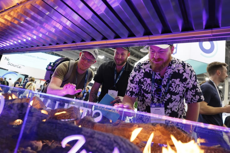 Men looking at a fireplace feature