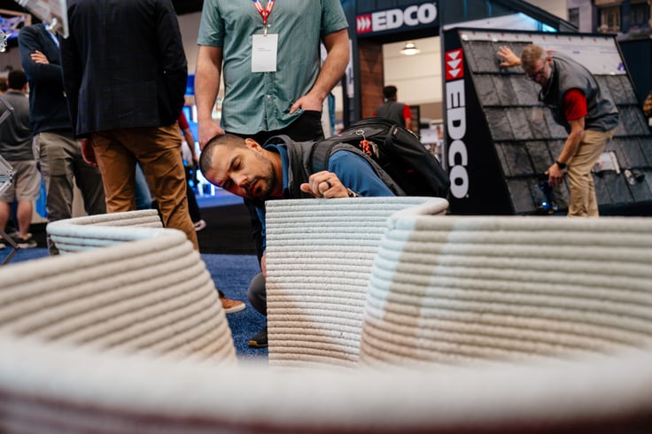 Attendee looking at product on exhibit floor