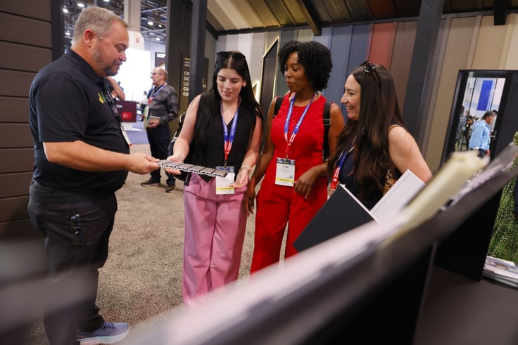 Women looking at wall siding
