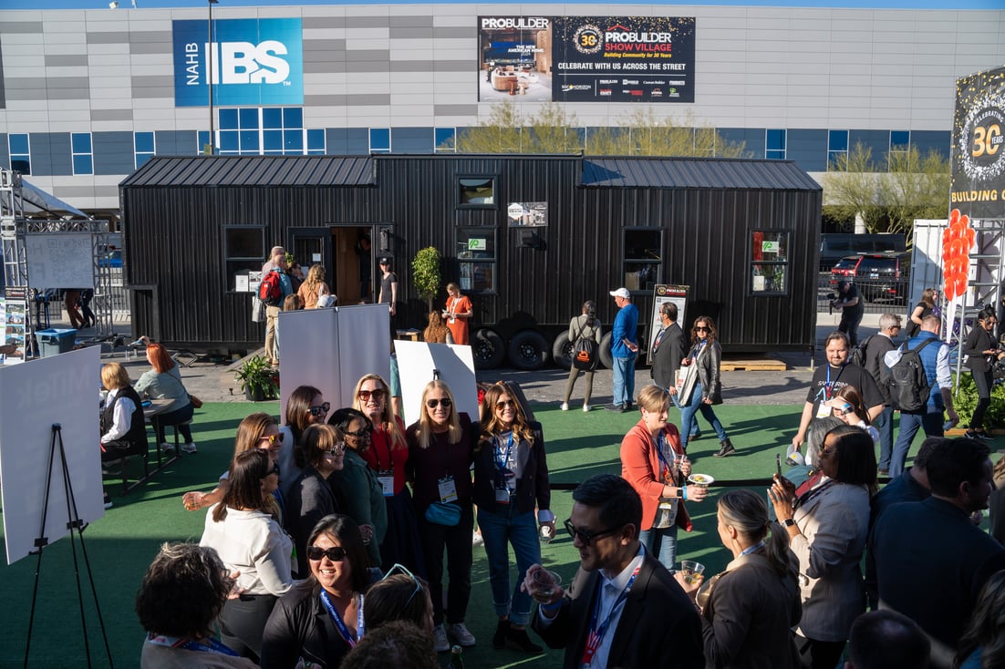 People walking outside to outdoor exhibits