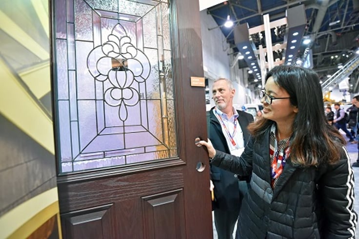 Woman smiling looking at a door