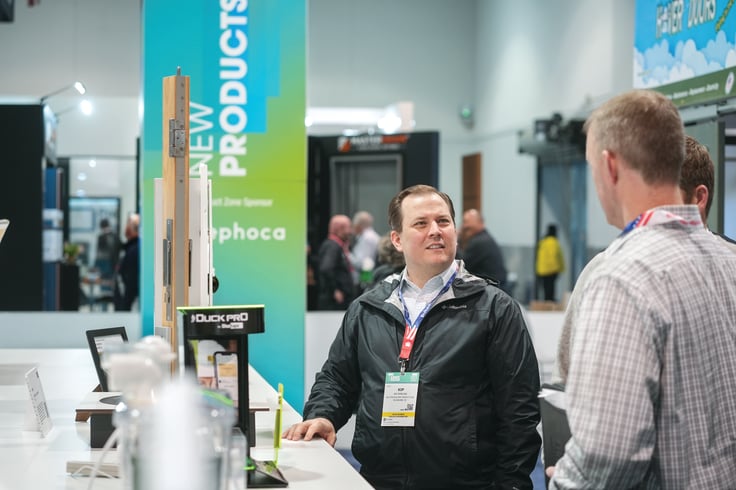 Building professionals discuss products on the IBS exhibit floor