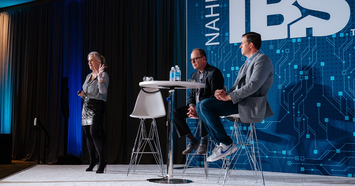 Speakers address a crowd at IBS 2026