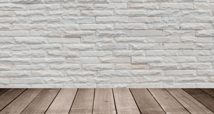 White brick wall with a wood floor
